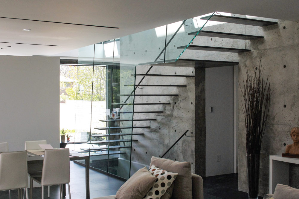 wall cantilevered / steel only steps / floor to ceiling glass / wall mount handrail / blackened steel handrail 