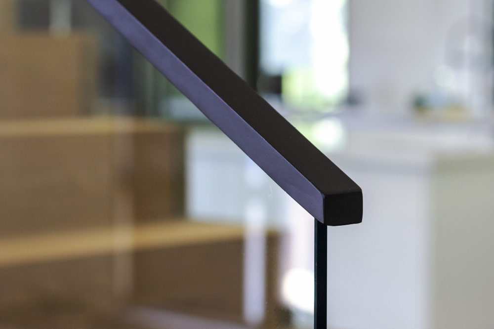 glass top mounted blacken solid steel handrails